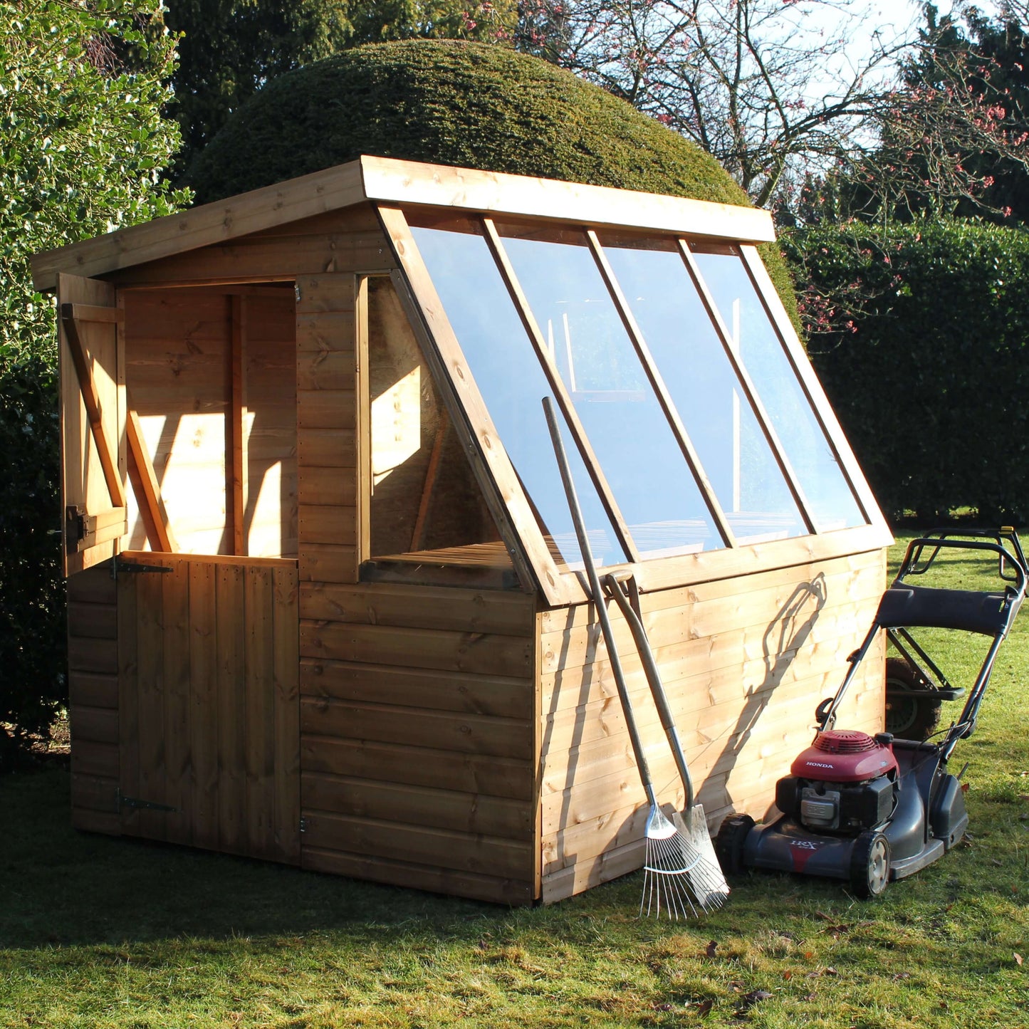 potting shed door open with mower