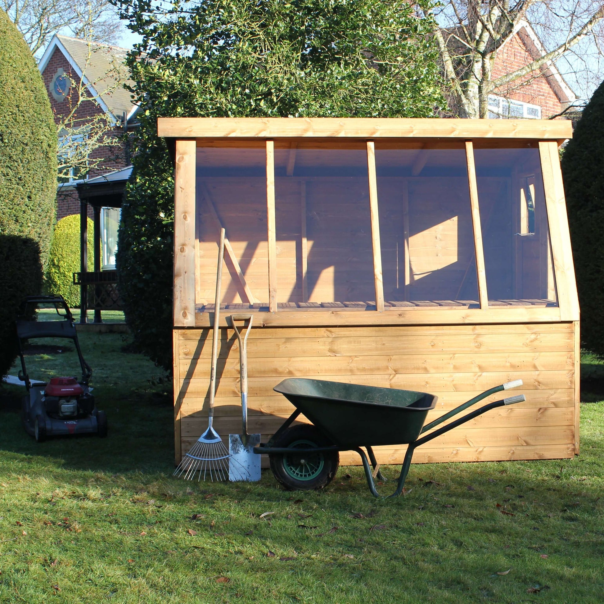 potting shed front view with wheel barrow