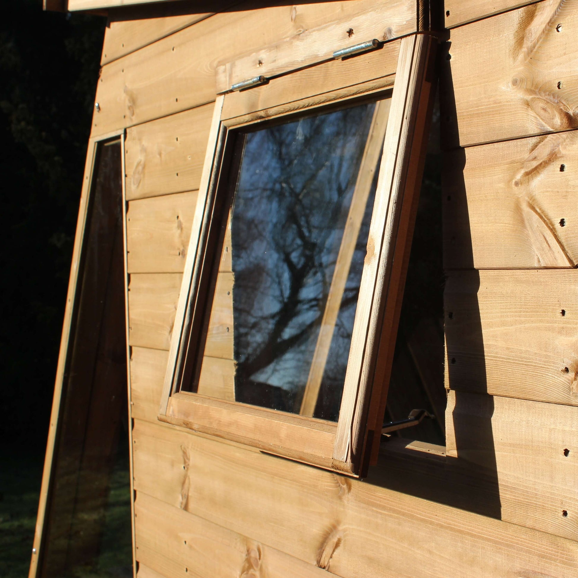 potting shed window open looking at it from the outside