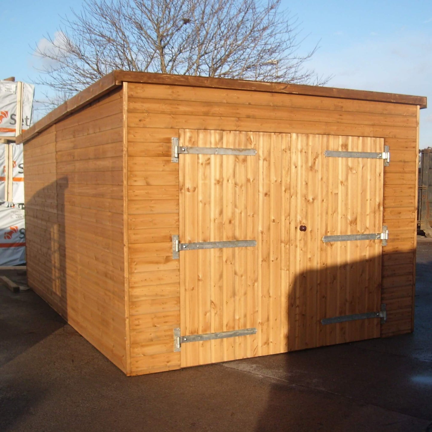 Timber garage shed with a pent roof, front view